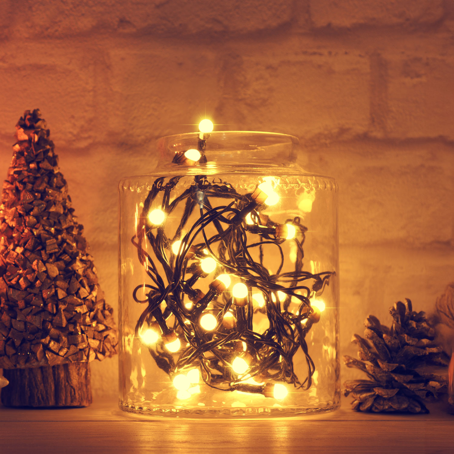 Glass vase filled with Christmas string lights